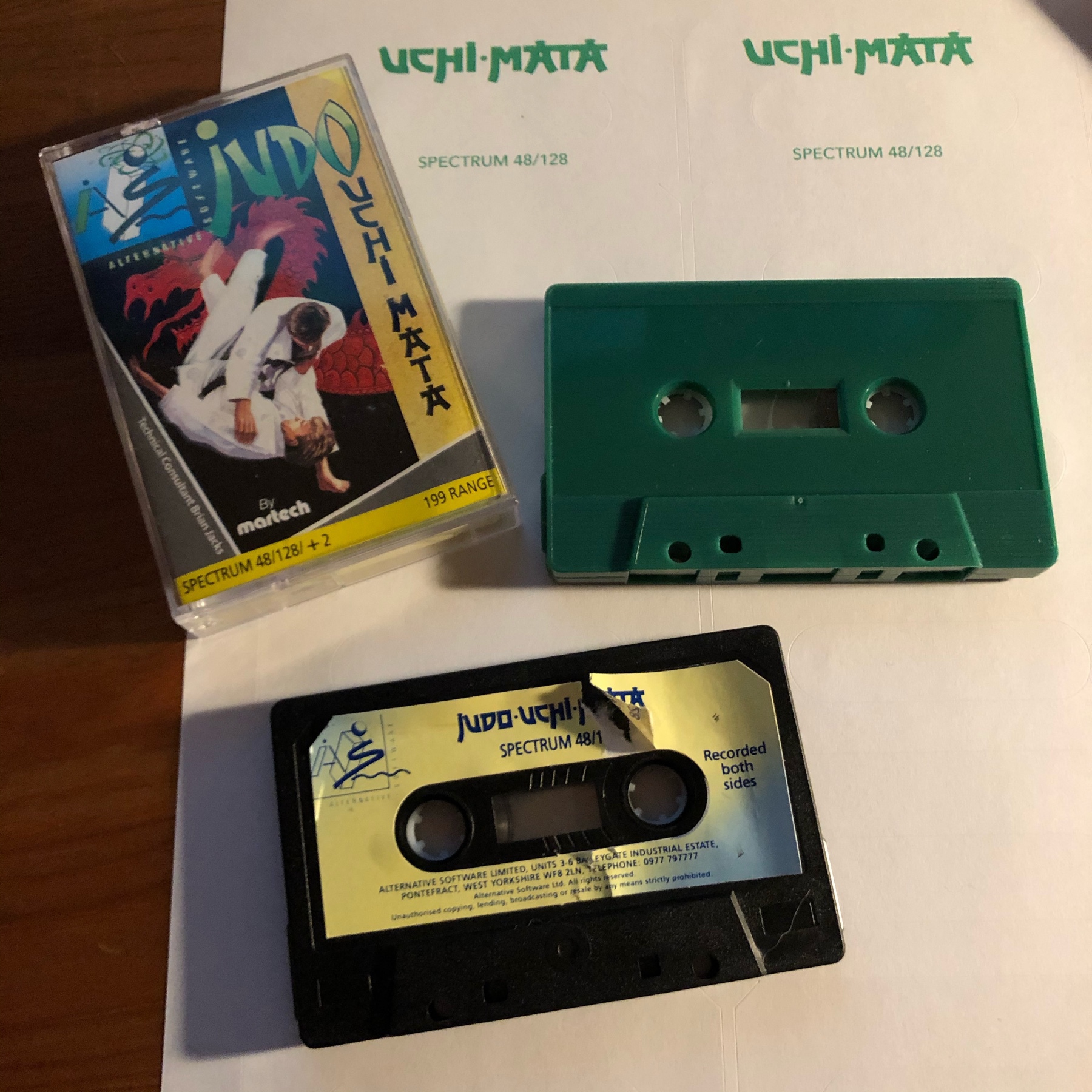 UCHI MATA JUDO game on cassette tape with a worn label, and a brand new green cassette with no label